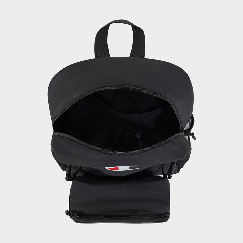 A Champion Kids' Mode Lunch Kit & Backpack Combo with the main compartment unzipped, showing a spacious interior. This active lifestyle set features a top handle and a separate zippered pocket at the bottom front.