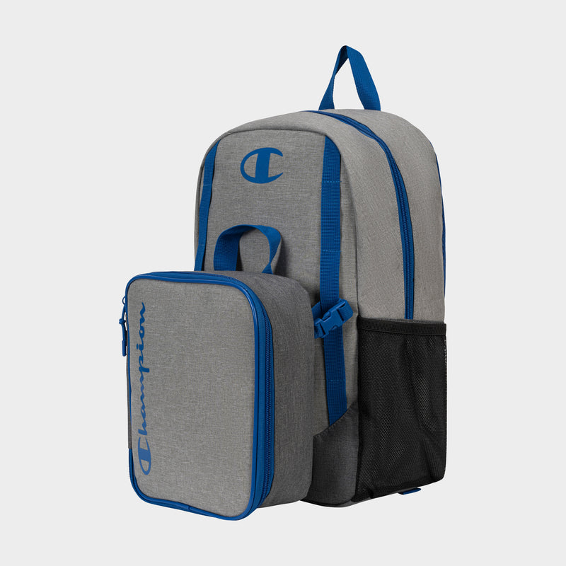 The Champion Kids' Mode Lunch Kit & Backpack Combo is a gray youth backpack with blue accents, logo detail, front zip pocket, side mesh pocket, and top handle—ideal for active kids and shown on a plain light background.