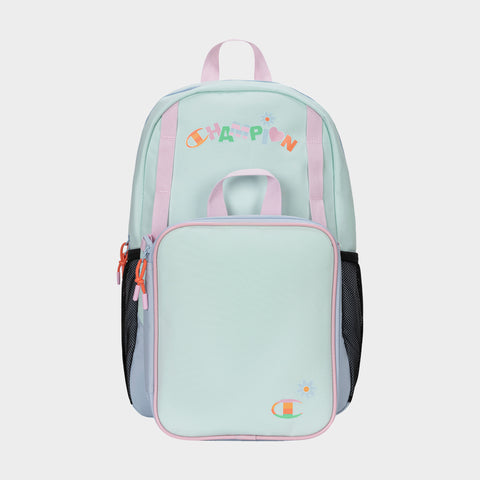 The Champion Kids' Mode Lunch Kit & Backpack Combo features a pastel design with pink straps, colorful CHAMPION lettering on top, large front pocket, side mesh pockets, and front logo—perfect for kids as an athletic backpack.