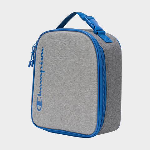 The Champion Kids' Merit Lunch Box is gray and rectangular with blue zipper, trim, and handle. "Champion" is printed in blue script on the front. Its insulated design keeps food fresh. It stands upright against a plain light background.
