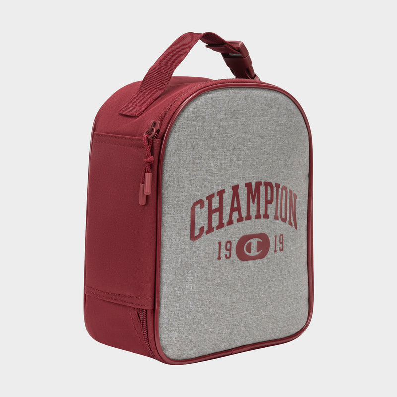 The Kids' Merit Lunch Box by Champion is a maroon and gray insulated lunch box with a handle, featuring "CHAMPION" and "1919" printed on the front in maroon letters and designed for excellent temperature control.