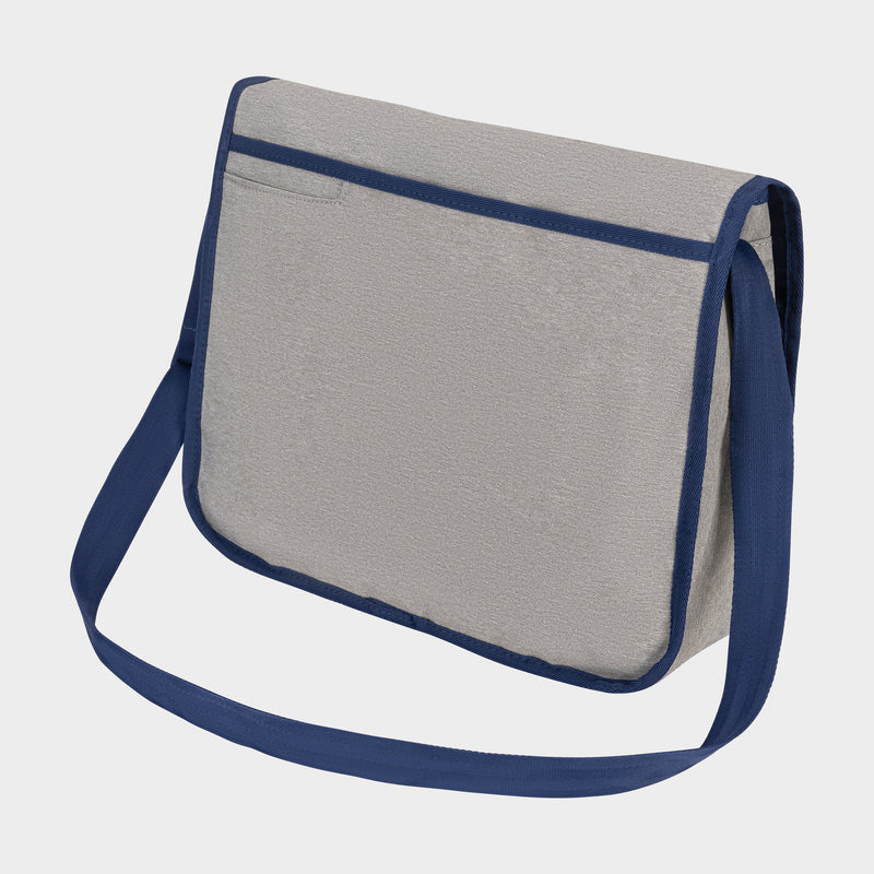The Champion Phase Messenger Bag is light gray with a flap closure, dark blue edging, and strap, displayed against a plain light background.