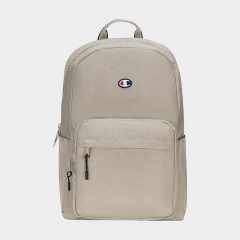 The Champion Level Backpack in beige features a front zipper pocket, small logo patch near the top, and padded laptop sleeve—ideal for daily use. Shown on a plain white background.