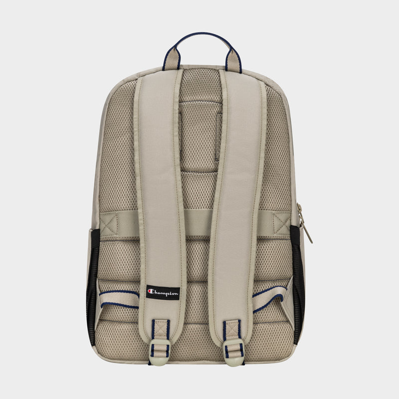 The Champion Level Backpack in beige is shown from the back with padded shoulder straps, mesh padding for comfort, a padded laptop sleeve, top handle, side mesh pockets, and a small Champion logo tag near the bottom of the straps.