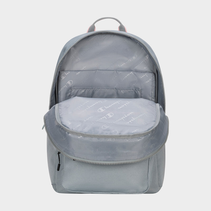 The Champion Steady Backpack in light gray features a spacious main compartment lined with patterned Champion logo fabric and a visible front pocket, making it a stylish and functional laptop backpack.