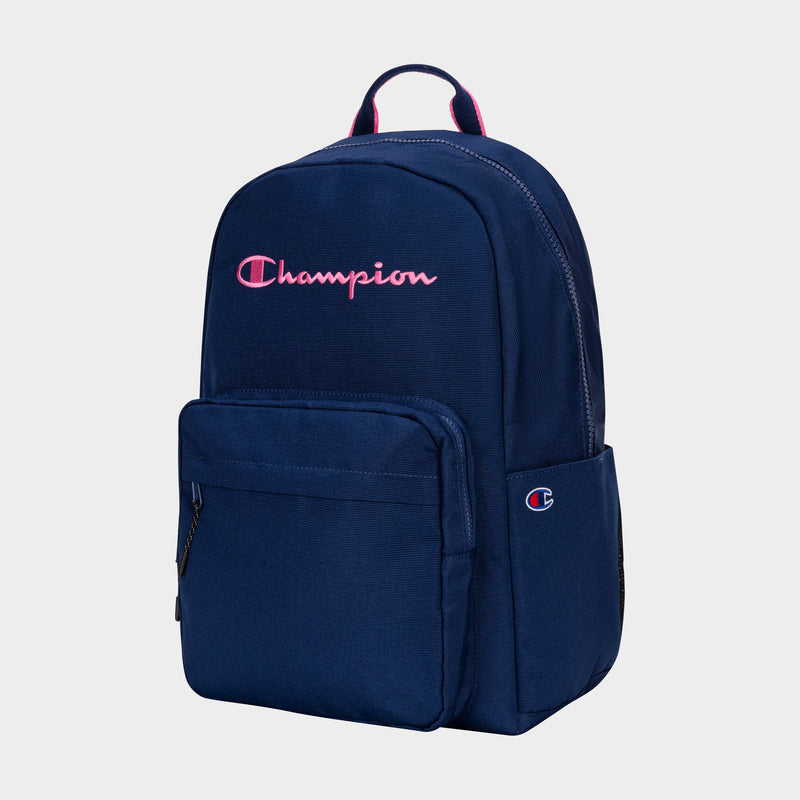 The Champion Steady Backpack in navy blue features a front zip pocket, side pocket, top handle, and a pink and white Champion logo—offering a simple, clean design that's perfect for carrying your essentials in style.
