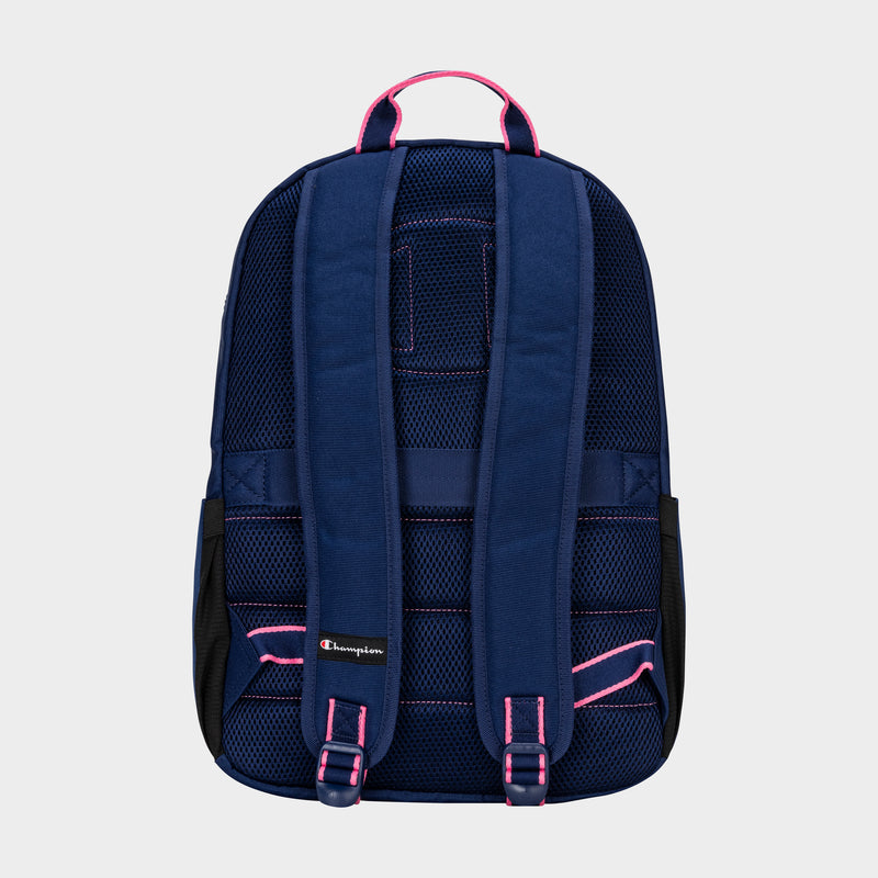 Back view of the Champion Steady Backpack in navy blue with pink-outlined padded shoulder straps, black mesh sides, and a small Champion logo on the left strap, shown against a light gray background.