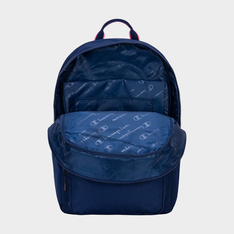 The Champion Steady Backpack in navy blue is shown unzipped, displaying its spacious, lined interior with a Champion logo pattern. Featuring a top handle, the empty laptop backpack is set against a plain light grey background.