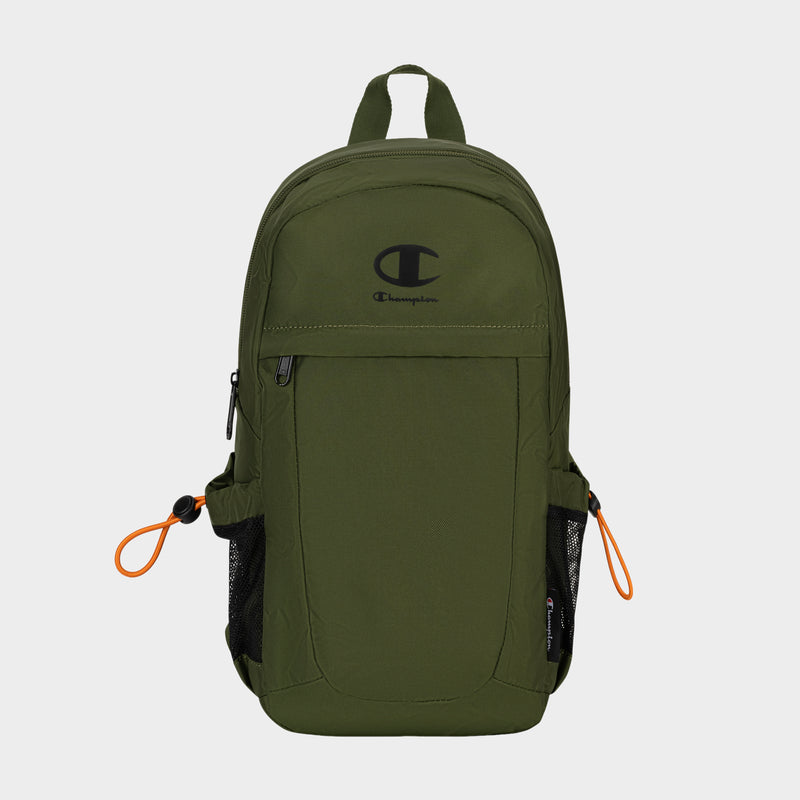 The Champion Camden Sling backpack, shown in olive green with a black logo, features front zip pocket, side mesh pockets, and orange zipper pulls. Made from durable nylon material, this sling bag includes an adjustable strap for comfortable carrying and is displayed on a plain light background.
