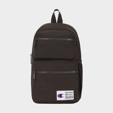 Introducing the Champion Explore Sling—a compact black sling bag featuring two front zippered pockets, a mesh side pocket, and a white Champion logo patch on the lower front. Designed for those who prefer to travel light, this sleek carry includes a top handle and black zippers, blending practical everyday utility with classic Champion style.