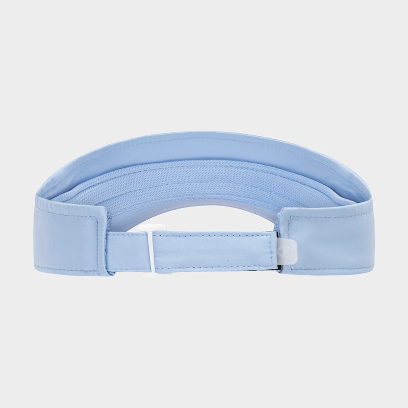 Back view of the Champion Solid Adjustable Visor in light blue, featuring an adjustable strap and a white plastic buckle, displayed against a plain white background.