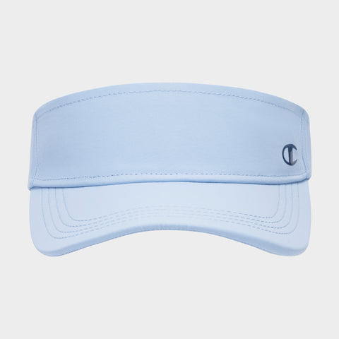 The Champion Solid Adjustable Visor is a sun-ready, light blue visor featuring visible stitching and a small dark blue Champion logo on the right side of the front band, displayed on a plain white background.