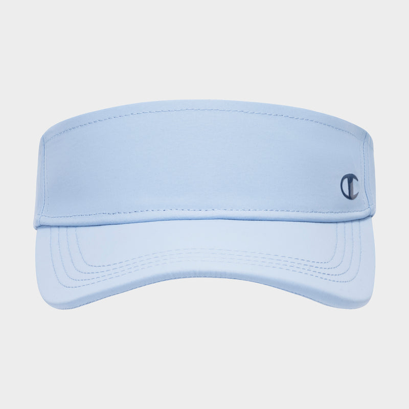 The Champion Solid Adjustable Visor is a sun-ready, light blue visor featuring visible stitching and a small dark blue Champion logo on the right side of the front band, displayed on a plain white background.