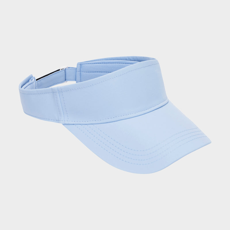 Solid Adjustable Visor by Champion in light blue, featuring an open top and curved brim, is displayed on a plain white background. Designed for sun protection and style, the adjustable band ensures a comfortable and customizable fit around the head.