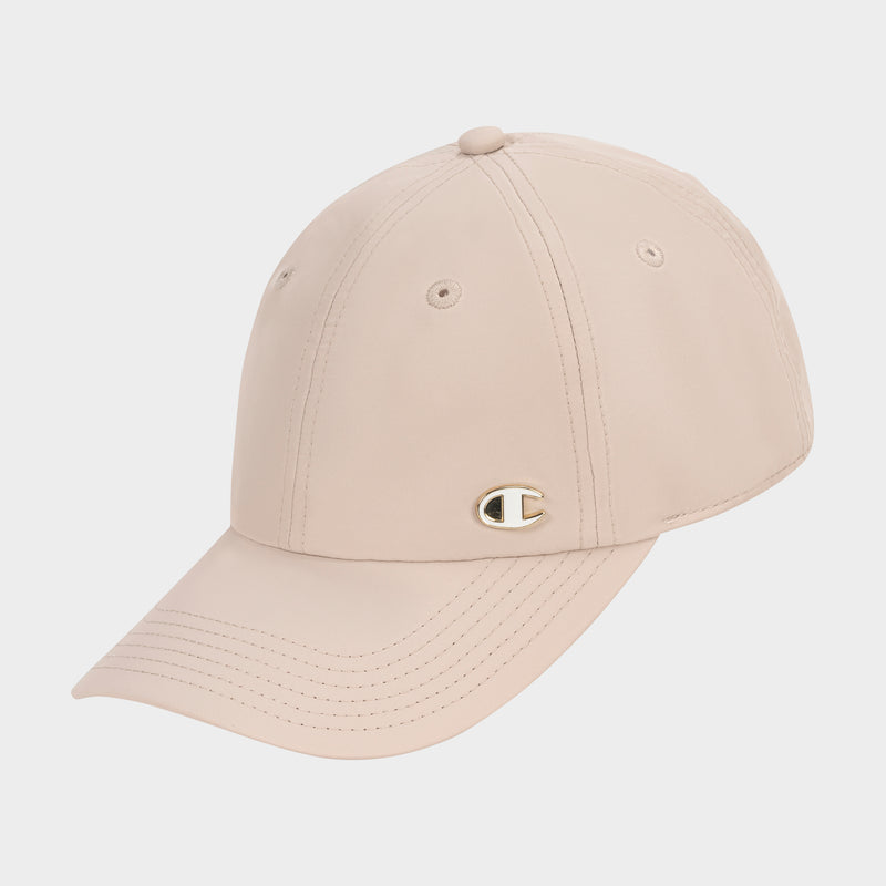 The Champion Lifestyle Sport Adjustable Baseball Cap features beige fabric, visible stitching, and a small gold Champion C logo on the front, all showcased against a plain white background.