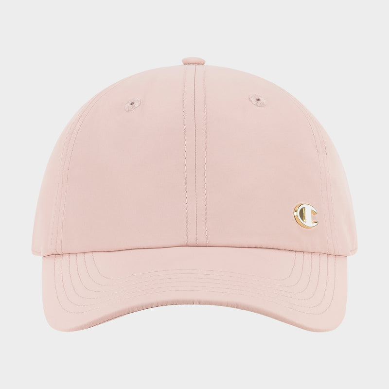 The Champion Lifestyle Sport Adjustable Baseball Cap features a light pink design, visible stitching, and a small gold C logo on the right front panel, offering everyday style and an adjustable fit. Displayed against a plain white background.