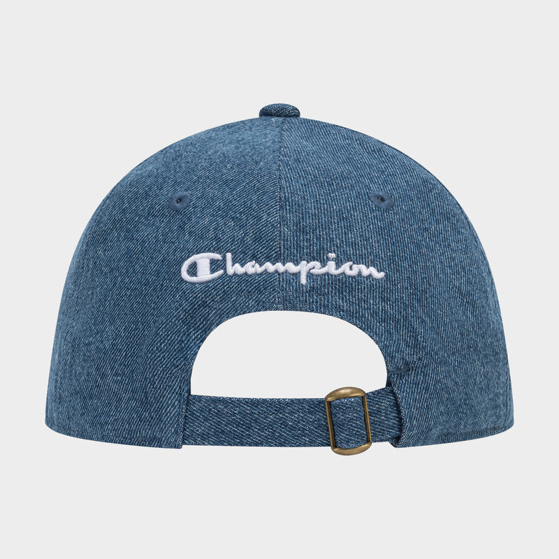The Champion Glen Denim Adjustable Baseball Cap, shown from the back, features white embroidery above an adjustable strap with a brass buckle.
