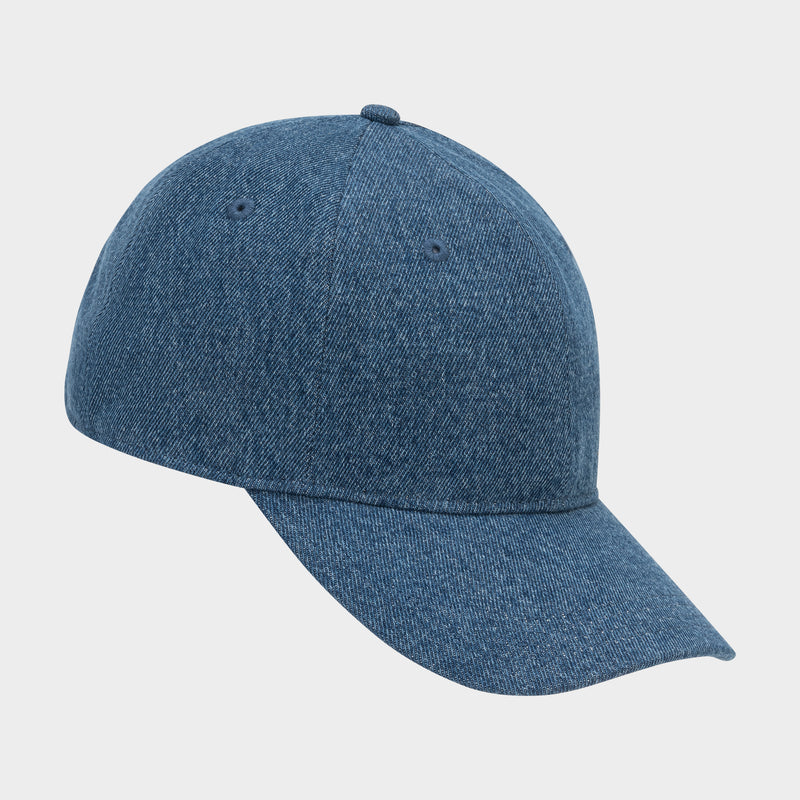 The Glen Denim Adjustable Baseball Cap by Champion features a classic blue denim style and curved brim, shown against a plain white background.