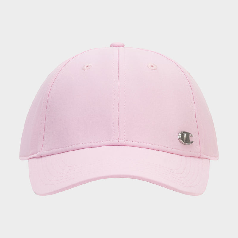 The Champion Ponytail Baseball Cap is light pink, made from performance stretch fabric with visible stitching, two ventilation eyelets, and a small silver C logo emblem on the front right side.