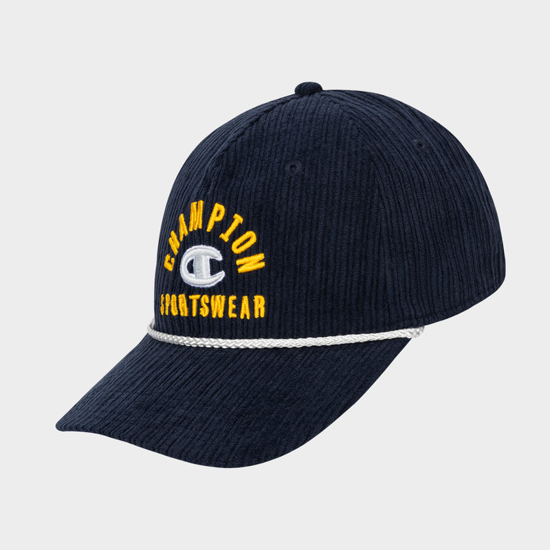 The Stephen Adjustable Cap by Champion features navy blue ribbed corduroy with “CHAMPION SPORTSWEAR” embroidered in yellow and white on the front, a white decorative rope across the brim, and an adjustable snapback closure.
