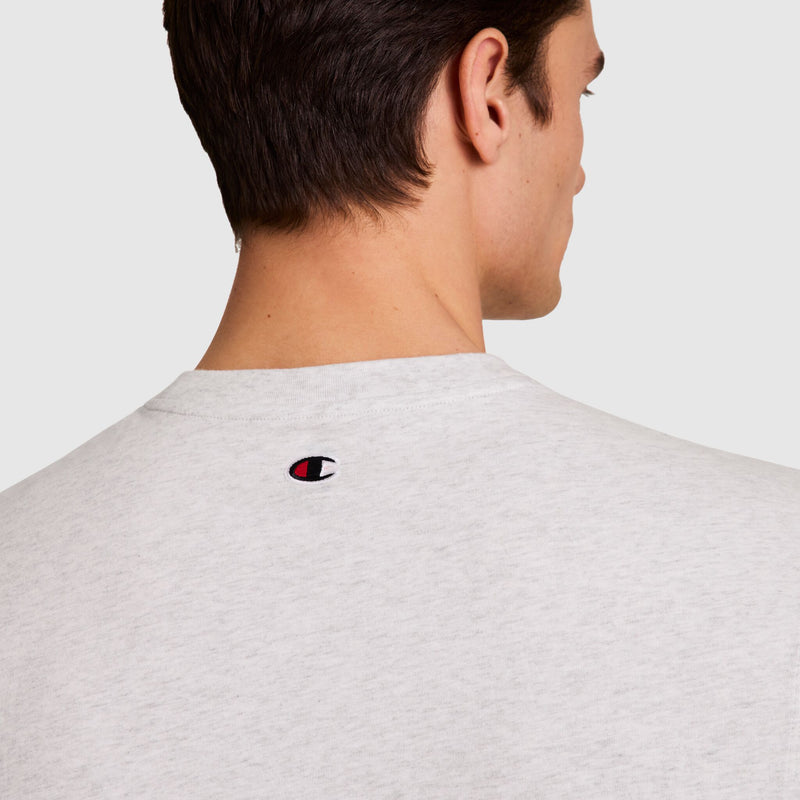 A man is shown from behind wearing the Champion Muscle Tank with a small embroidered C logo near the back neckline, set against a plain, neutral background.