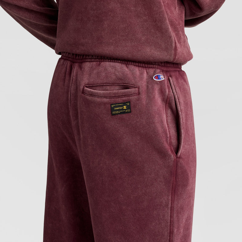 Maroon Champion Mineral Wash Open Hem Pant featuring a back pocket, a logo patch, and a small embroidered logo on the hip.