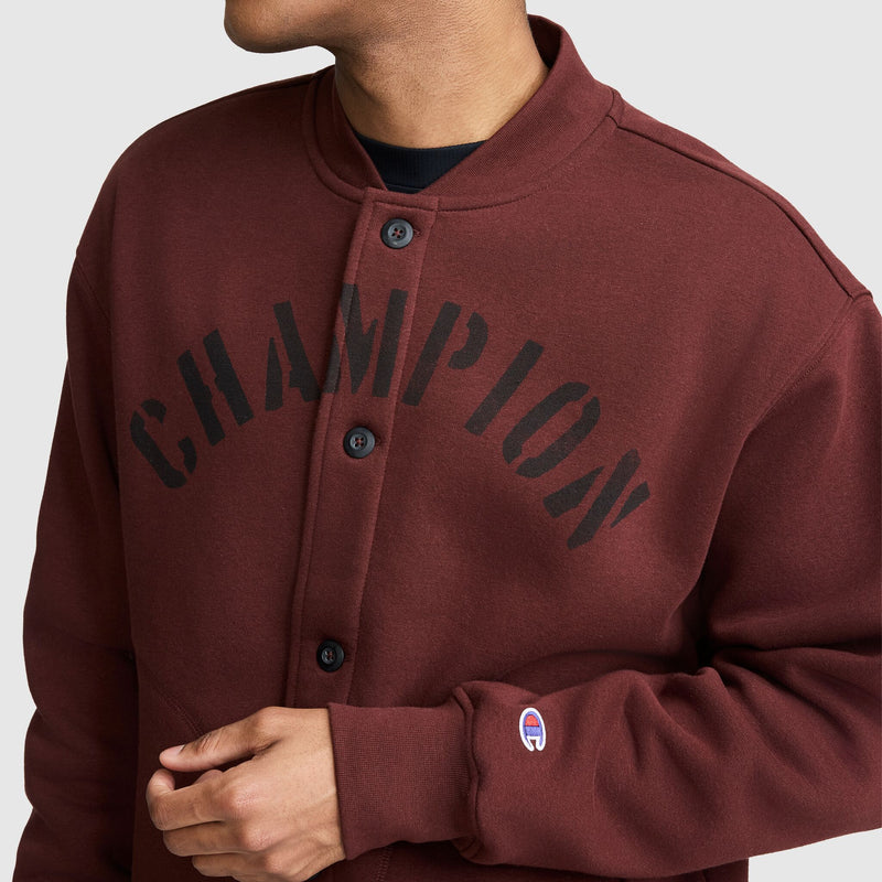 Maroon Champion Fleece Baseball Jacket with a curved logo across the chest and a small embroidered logo on the sleeve.