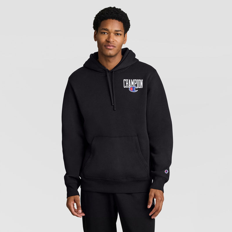 A man wearing a black Fleece Hoodie, Left Chest Graphic, with a logo on the left chest.