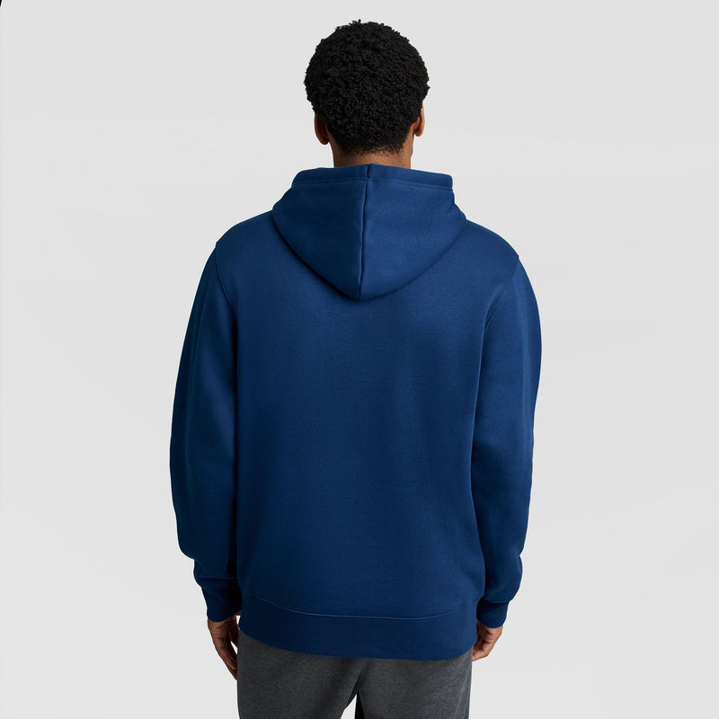 A person seen from behind wearing a solid blue Champion Fleece Hoodie, Left Chest Graphic.