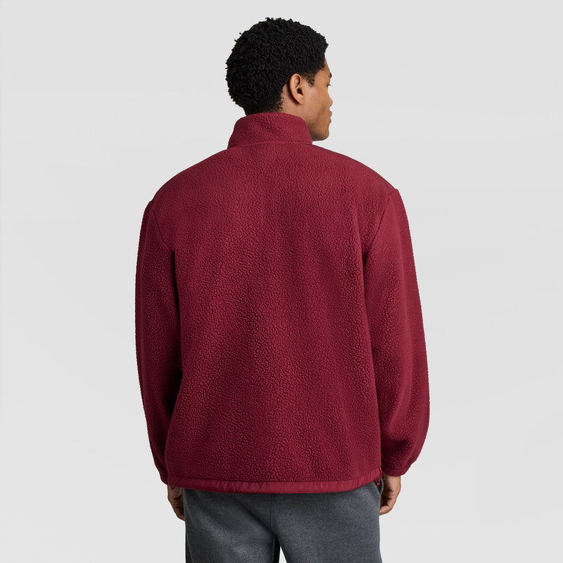 A person seen from the back wearing a dark red, textured Champion Polar Fleece Quarter Zip.