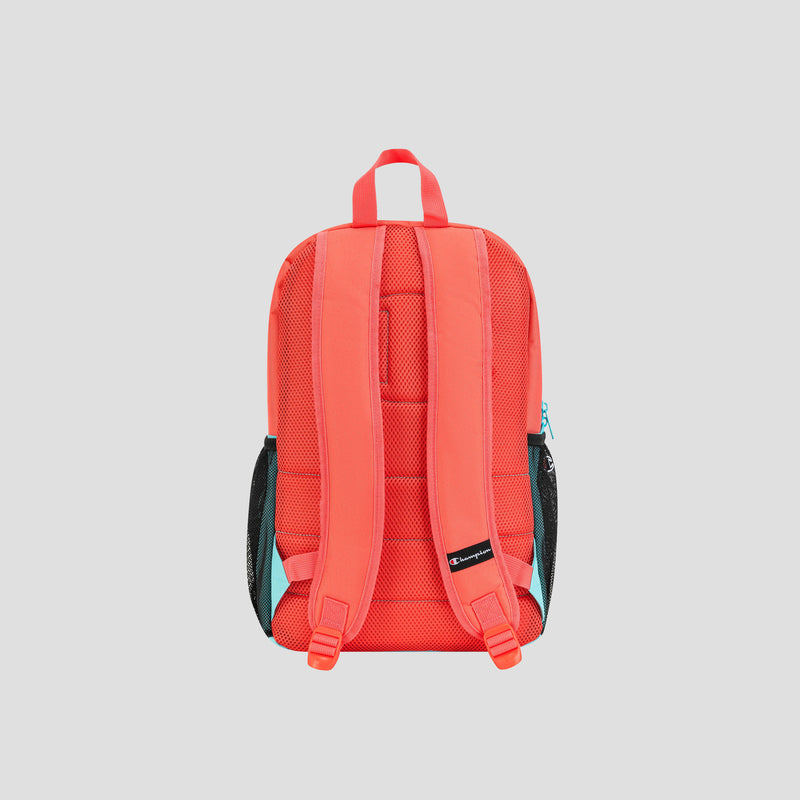A vibrant red Champion Kids’ Merit Backpack featuring padded shoulder straps, black mesh side pockets, and a top handle is displayed against a light gray background, with the back of the backpack facing forward.
