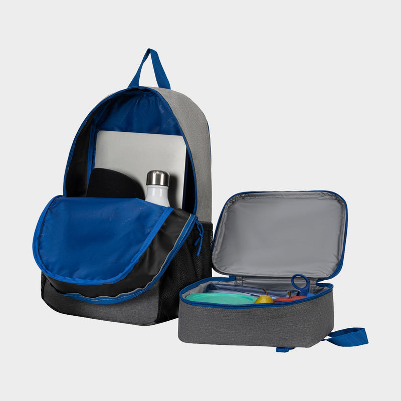 A gray and blue Champion Kids’ Mode Lunch Kit & Backpack Combo is shown, featuring a backpack with an open front pocket displaying a laptop and water bottle, alongside an open insulated lunch kit containing food containers and utensils.