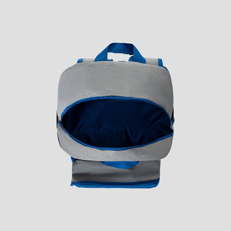 The Champion Kids’ Mode Lunch Kit & Backpack Combo is displayed with its top compartment unzipped, revealing a dark blue interior. Featuring a gray and blue design with a blue handle on top, the bag is set against a plain light gray background.