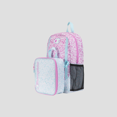 A pink and light blue floral-patterned Champion Kids’ Mode Lunch Kit & Backpack Combo, featuring an insulated lunch box attached to the front and a black mesh side pocket, set against a plain gray background.