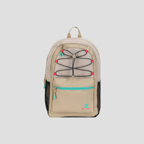 The Champion Kid’s Bungee Backpack features a beige design with black side pockets, a black bungee cord crisscrossed on the front, and a turquoise zipper on the front pocket. A turquoise and pink Champion logo adds a pop of color, while tan top handle and zipper pulls complete the look. This durable youth sports backpack is ideal for active days, delivering both style and reliable quality from Champion.