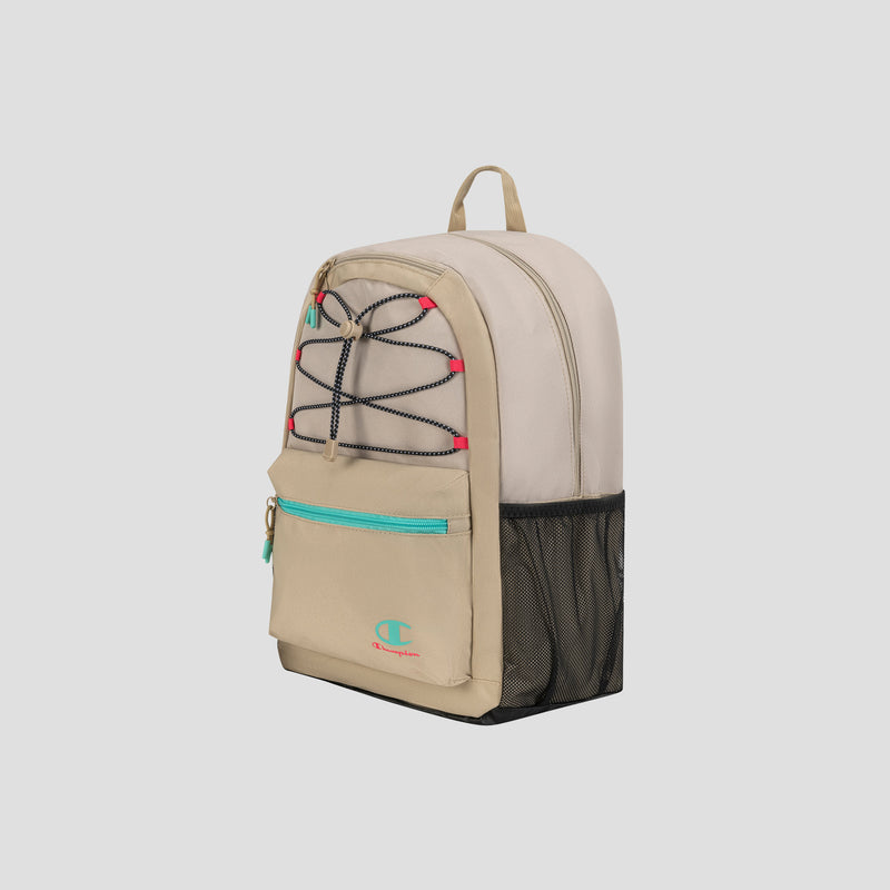 The Champion Kid’s Bungee Backpack features a stylish beige and tan design with turquoise accents, black bungee cords, a front zipper pocket, black mesh side pocket, red details, and a beige top handle. Perfect for youth sports, this durable backpack is displayed against a plain light background.