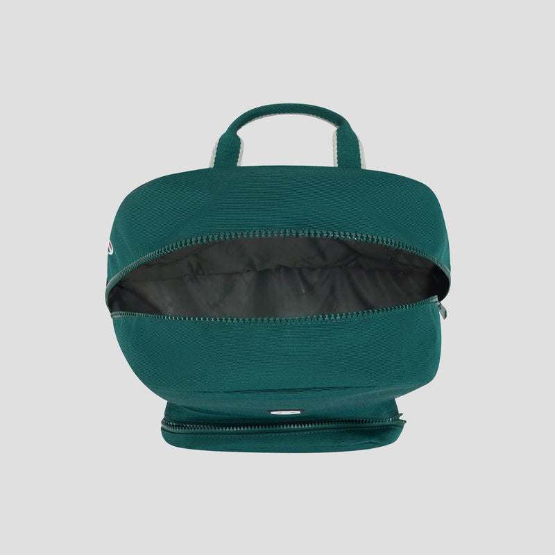 A teal Champion Level Backpack is displayed from an overhead angle with the main zipper open, showcasing an empty interior and cleverly designed compartments for organization. Two small top handles are visible, along with a secondary zipper compartment at the bottom, emphasizing the backpack’s durable and well-thought-out construction.