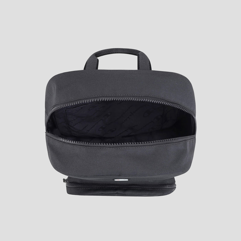 A Champion Level Backpack is displayed from a top-down perspective with the main zipper compartment open, showcasing its fabric-lined interior and a small handle at the top. Ideal for everyday use, this durable Level Backpack by Champion is photographed against a simple light gray background.