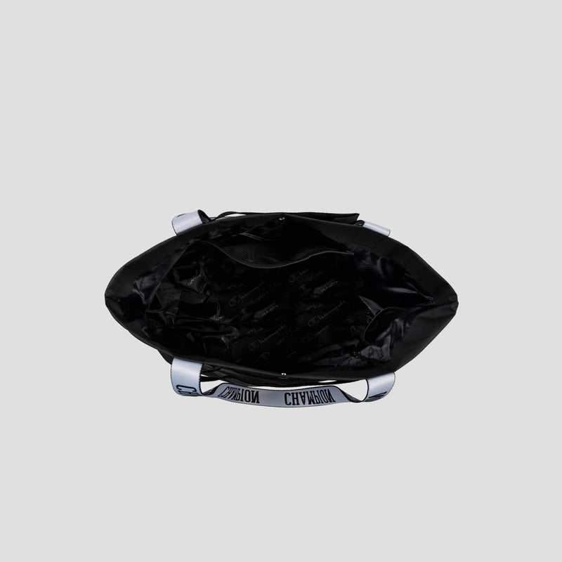 Top view of an open black Champion Miller Coated Shopper Tote featuring weather-resistant material, silver handles with printed text, and a spacious black interior lined with a repeating pattern. This roomy tote also offers organizational pockets to help keep your essentials neatly arranged.
