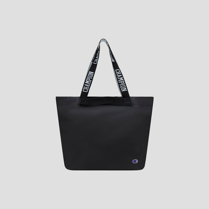 Miller Coated Shopper Tote by Champion in black, featuring “CHAMPION” text on the handles and a small Champion logo at the bottom right corner, displayed on a plain light gray background. This spacious shopper tote includes organizational pockets, making it ideal for keeping your essentials neatly arranged.