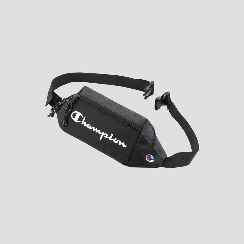 A black Champion Monitor Waist Pack with a zippered pocket and adjustable strap, featuring the white Champion logo on the front and a small Champion emblem on the side.