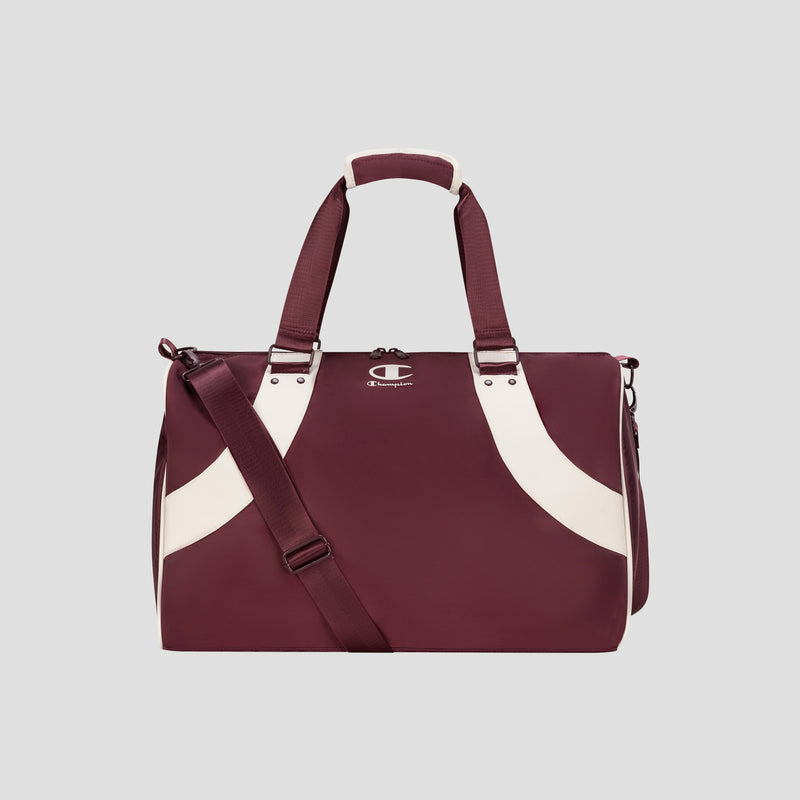 The Champion Oracle Duffel Bag in maroon, featuring white curved stripes, top handles, a shoulder strap, and a small Champion logo on the front, is displayed against a plain light gray background. This versatile gym bag is ideal for both workout sessions and travel.