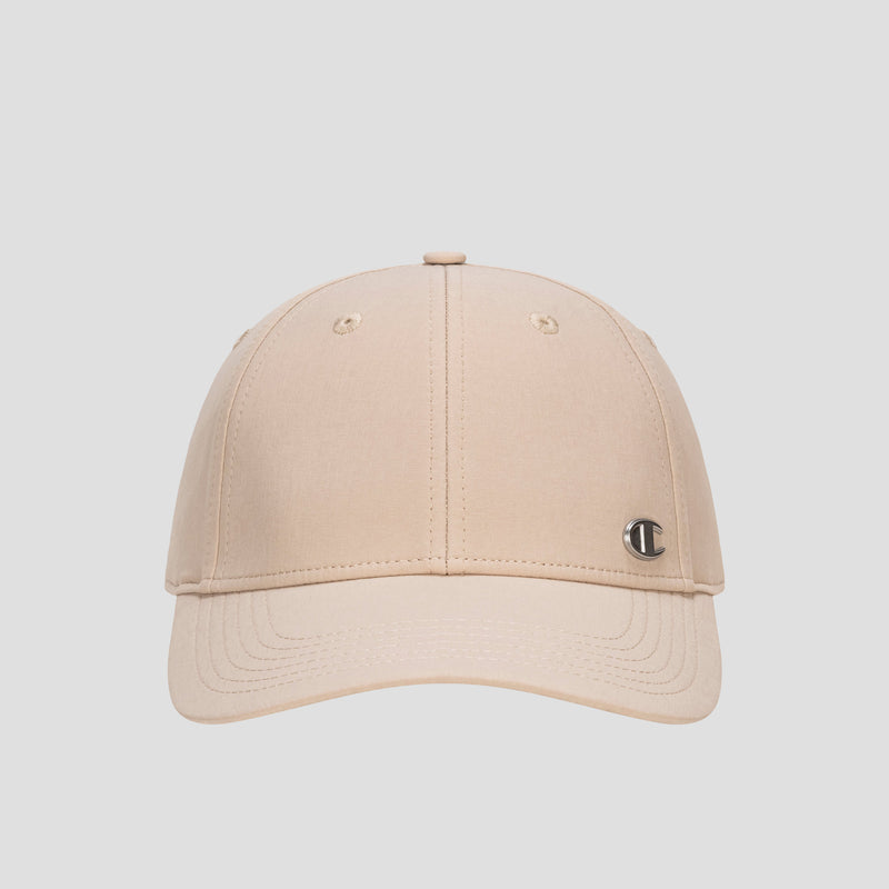 A beige Ponytail Baseball Cap by Champion, crafted from performance stretch fabric and featuring a small silver C logo on the front left panel, is displayed against a plain light gray background.