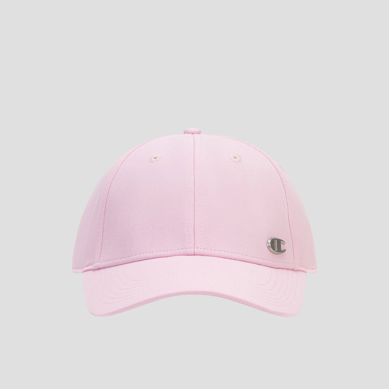 The Champion Ponytail Baseball Cap, rendered in light pink and crafted from performance stretch fabric for enhanced comfort, showcases a curved brim, ventilation eyelets, and a small metallic logo patch on the front left panel. Designed to accommodate a ponytail, this baseball cap is displayed against a plain light gray background.
