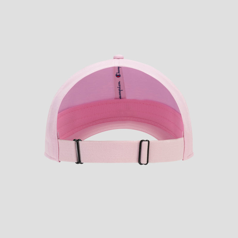 The Champion Ponytail Baseball Cap is shown from the back in light pink, crafted from performance stretch fabric for enhanced comfort. It features an adjustable strap with a metal buckle and is designed to accommodate a ponytail. The interior lining displays repeated Champion text, all set against a plain gray background.