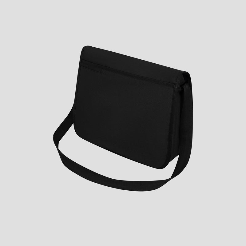 The Champion Phase Messenger Bag is shown on a light gray background. This plain black bag features a minimalist design and a long strap, with a zippered front compartment that makes it perfect for commuters.
