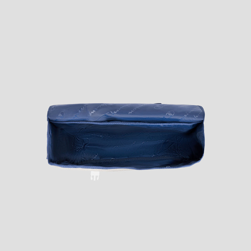 A blue, rectangular Champion Phase Messenger Bag made of fabric and featuring a zipper is displayed from above against a plain light gray background. The bag appears empty and slightly crumpled, making it an ideal padded laptop sleeve for urban commuters.