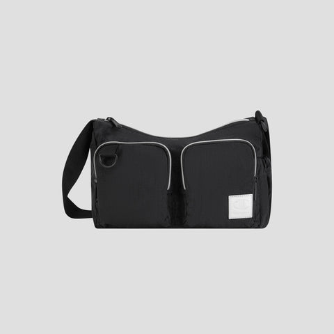 The Champion Quartz Small Messenger Bag, crafted from lightweight black nylon, features two front zippered pockets, a white rectangular patch, and an adjustable strap. It is photographed against a plain light gray background.