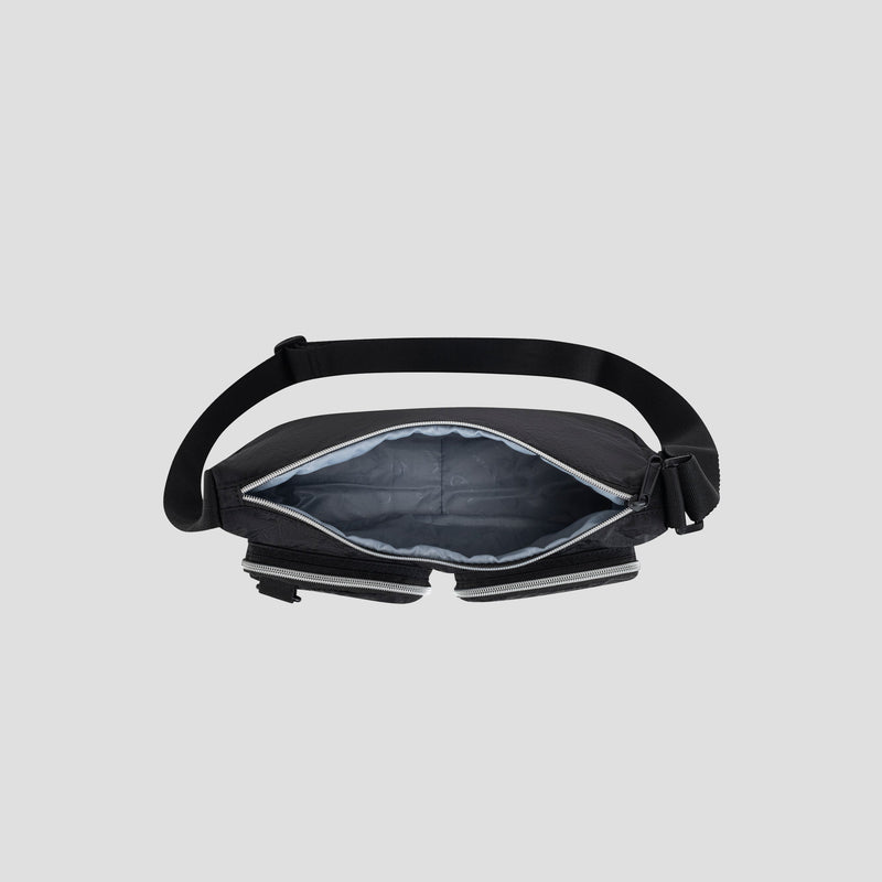 A top view of the Champion Quartz Small Messenger Bag, shown open with a padded gray interior and adjustable strap, displayed on a light gray background.