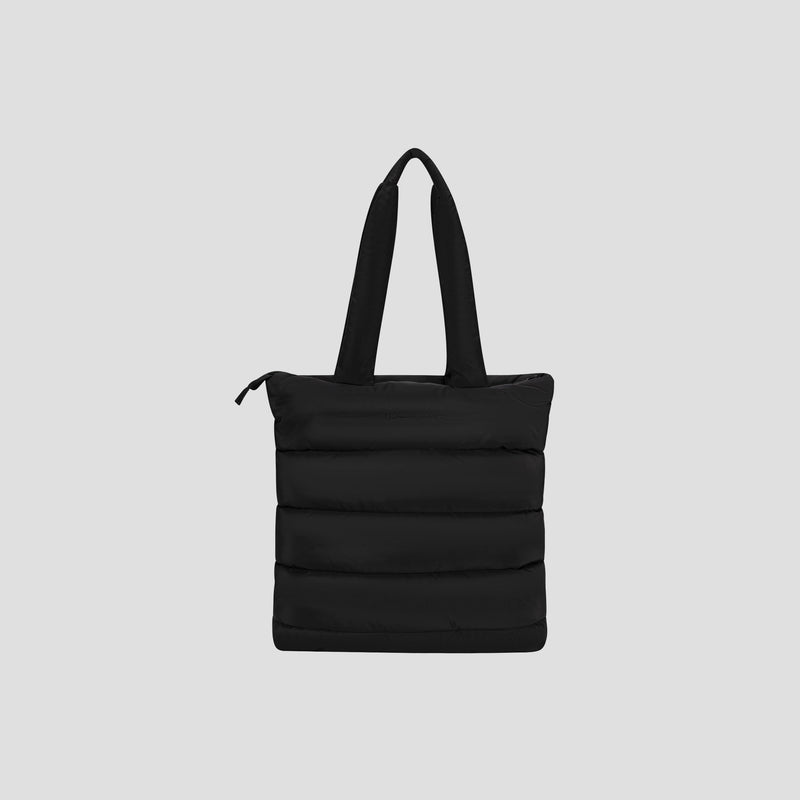 The Champion Quilted Billie Tote, featuring a sleek black quilted design with two padded handles and a zippered top, is perfect for everyday use and is displayed against a plain light gray background.